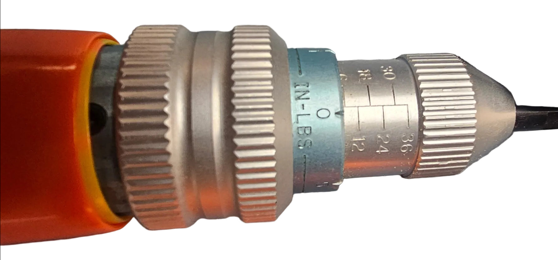 Close-up of a precision tool shank or caliper-like measuring component with silver metal rings, engraved measurement markings, a blue ring near the center, and an orange handle visible at the bottom, photographed on a gray surface.