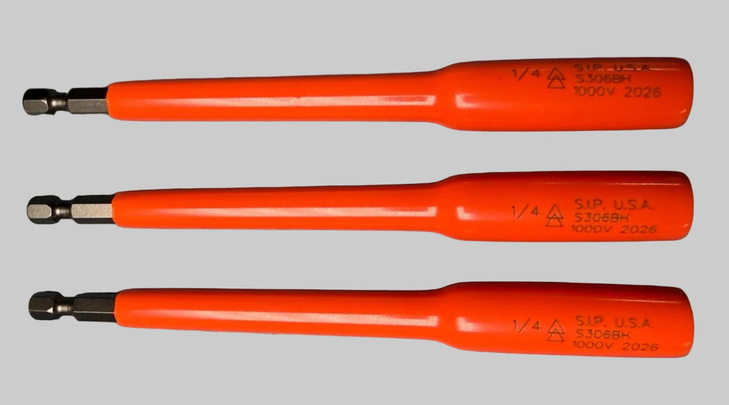 Three orange-handled precision screwdriver bits arranged vertically on a textured gray surface.