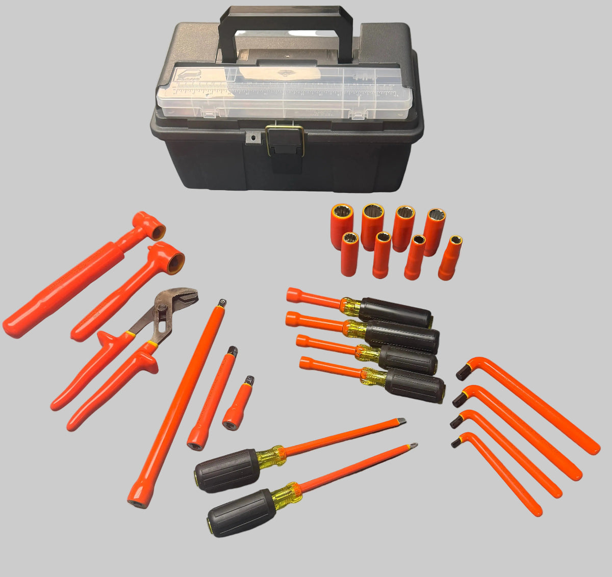 A socket wrench tool set with various orange and black hand tools arranged on a blue-gray workbench, with a black plastic storage case at the top and a small instruction booklet in the upper right corner.