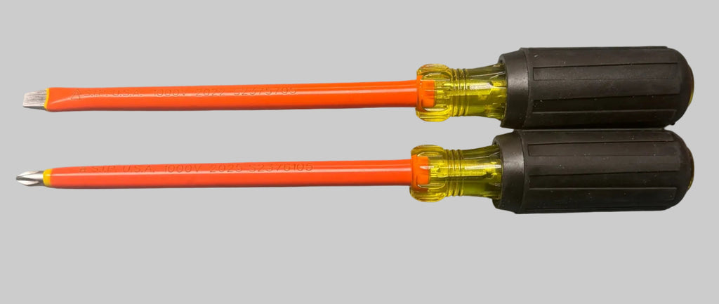 Two flathead screwdrivers with bright orange handles and black ribbed grips, shown against a solid gray background.